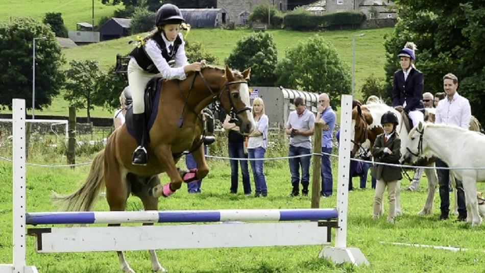 Crowds enjoy show jumping at Weardale Show.