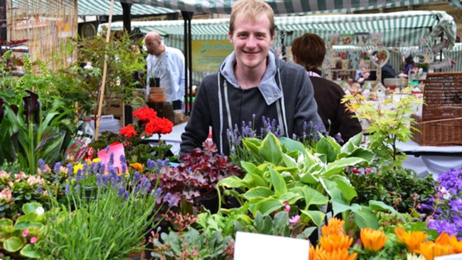 Man with flowers at Durham City Farmers' Market