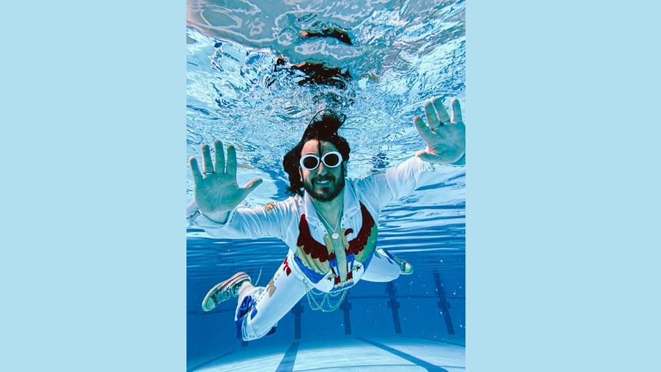 Elvana frontman in swimming pool.