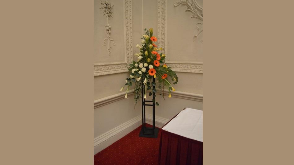 Flower arrangement with white and orange flowers
