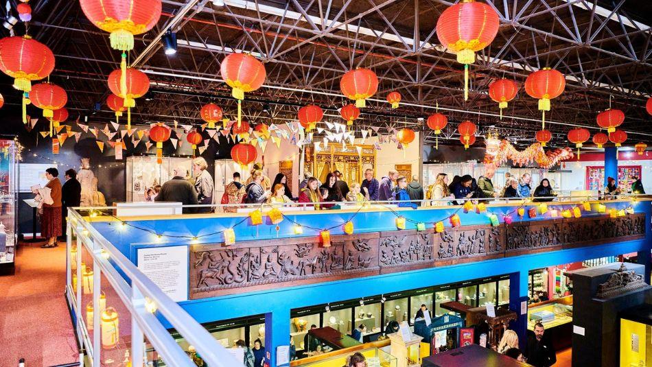 people standing under colourful lanterns as part of the Lunar New Year celebrations at Durham oriental Museum.