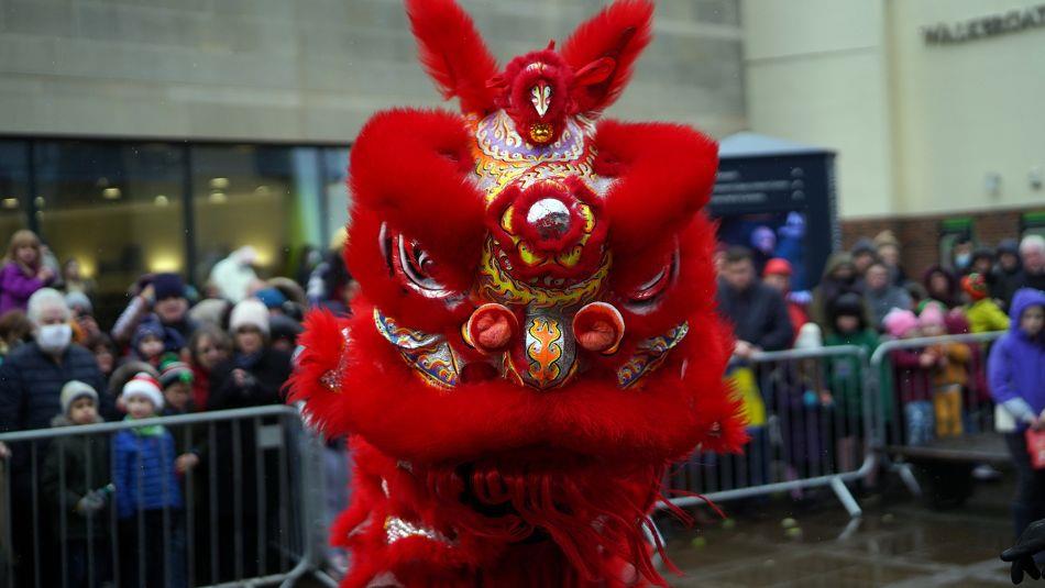 People stood watching the traditional lion dance at Millennium Place Durham, part of the Lunar New Tear celebrations.