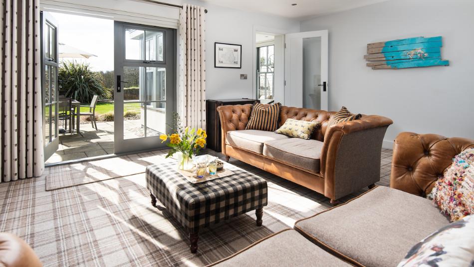 Light and airy lounge with French windows opening onto the garden.