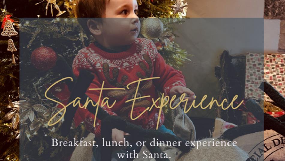 Text reads, 'Santa Experience'. An infant in a Christmas jumper in front of a tree.