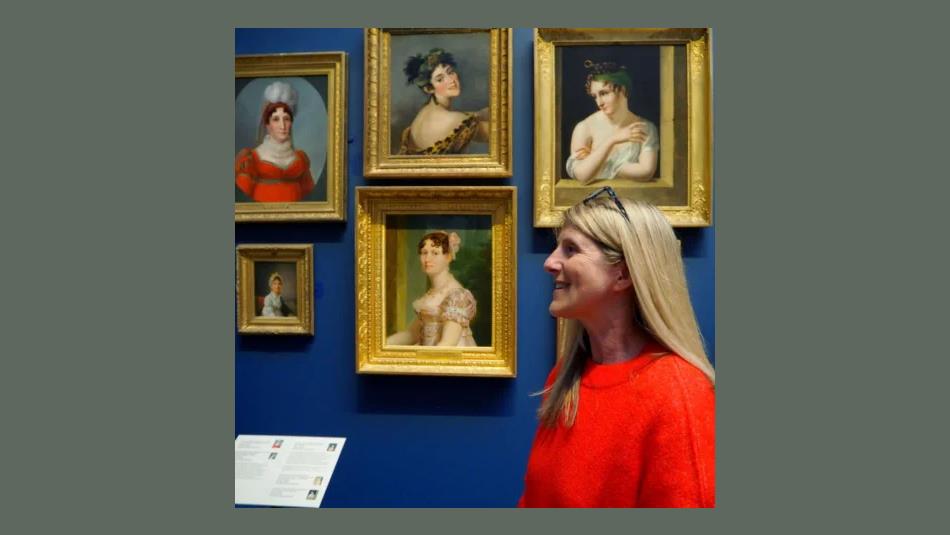Image of a woman looking at paintings in The Bowes Museum