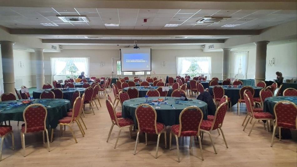 Summerson conference suite
Cabaret style tables with projector screen in the middle of the far wall