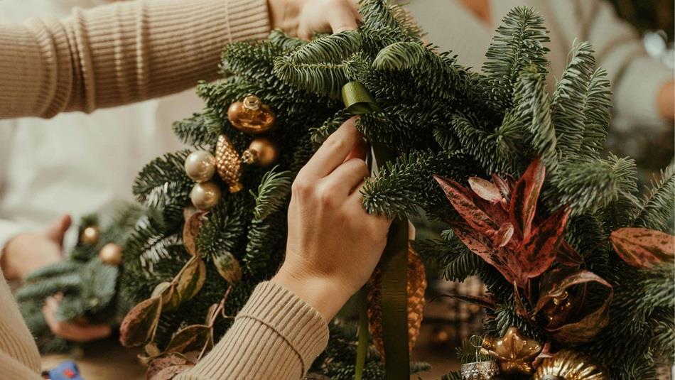 Someone making a Christmas Wreath