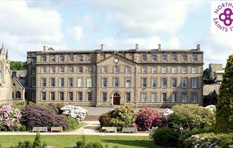 Exterior view of the front of Ushaw with Northern Saints Trails logo