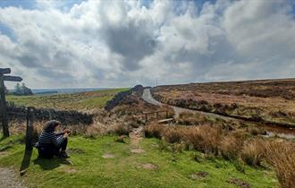 Countryside around Blanchland with women using App.