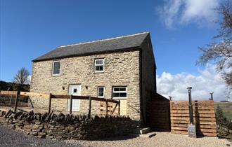 Front of barn with hot tub