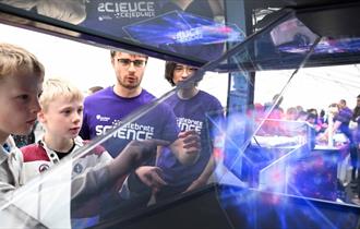 Children looking at one of the exhibits