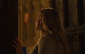 A woman peering out of one the Cathedral’s secret spaces that are rarely open to the general public.