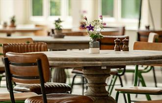 The Vinery at Raby Castle - flowers on tables.