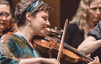 Close up shot of violinist in the Royal Northern Sinfonia