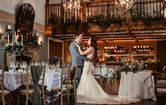 Bride and Groom embracing at The Manor House Hotel and Spa.