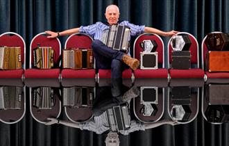 John Kirkpatrick with his array of squeeze boxes.