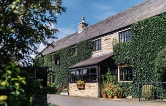 Exterior image of South Causey Inn on a sunny day.