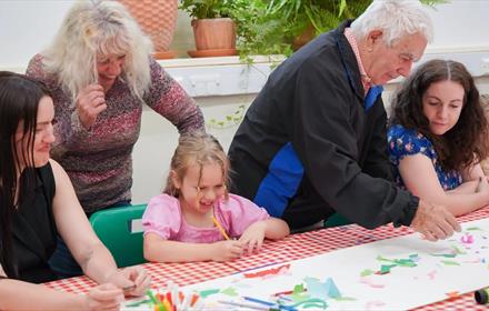 A family enjoying arts and crafts at Ushaw