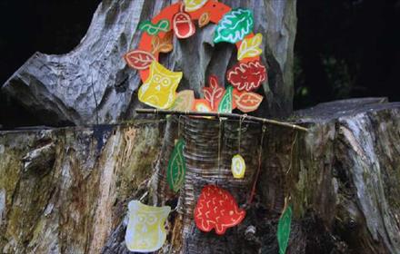 Colourful Autumn prints of hedgehogs, owls, and leaves on a tree at Ushaw