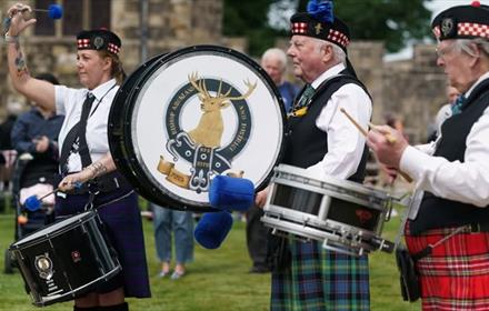 Three drummers performing