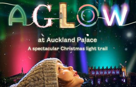 AGLOW advertising poster with a child looking up to the nights sky with AGLOW illuminated in colours