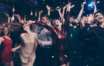 A group of people enjoying an Ultimate Party night at the Radisson Blu