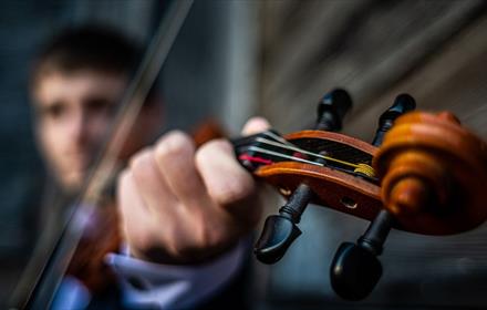 A man playing the violin