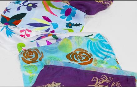 Image of brightly coloured, patterned textiles.