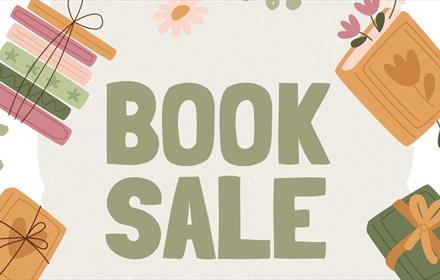 The wording Book Sale with illustrations of books