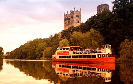 The Prince Bishop River Cruiser sailing on the River Wear in Durham City with the Cathedral in the background