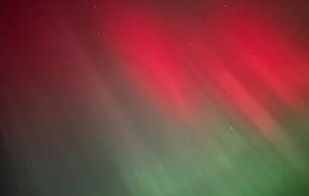 The Aurora Borealis in colours green and red