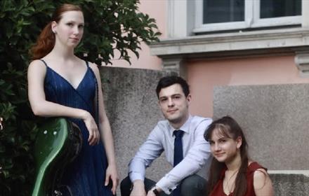 Three musicians, one man and two women.