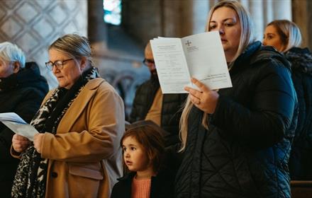 Congregation taking part in the Carols for All service