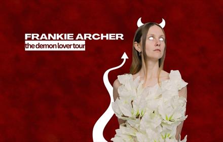 Event poster, a woman with devil horns and tail dressed in white
