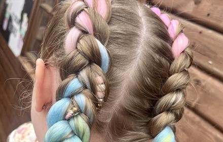Child with colourful hair braids