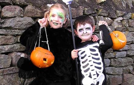 Two children dressed in Halloween costumes at Hall Hill Farm