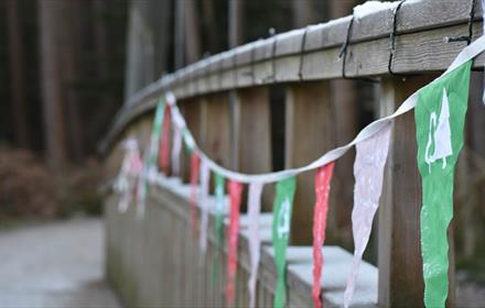 Hamsterley Christmas bridge with bunting.
Credit: Forestry England/Crown Copyright
