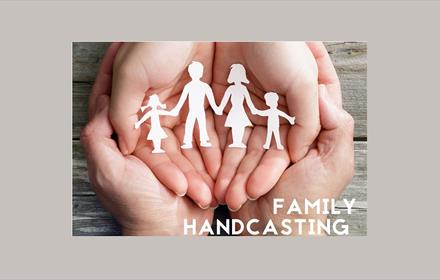 hands holding a family paper chain