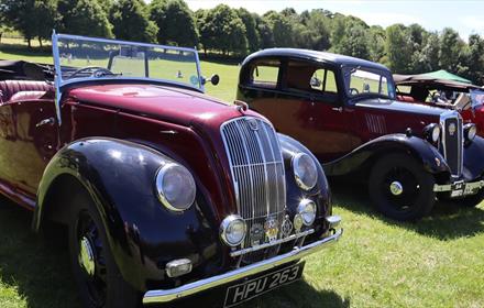 Classic Morris cars parked on a field at Beamish Museum