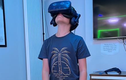 Child wearing a virtual reality headset