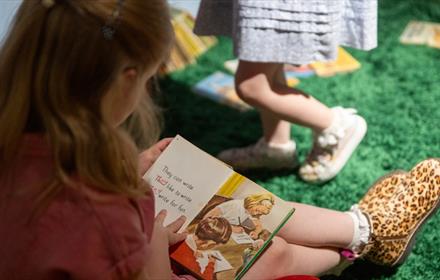 Child reading a Ladybird book