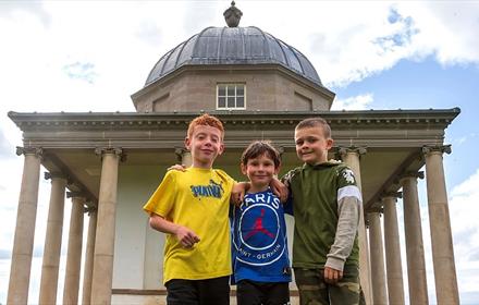 Image of three children outside the Temple of Minerva at Hardwick Park.