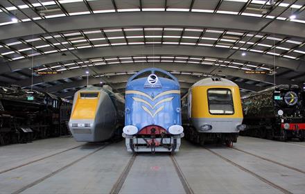 Locomotives at Locomotion, one blue, two yellow and grey  Image copyright - The Board of Trustees of the Science Museum Group