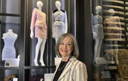 Pamela Brewis with some of the clothes she donated on display at The Bowes Museum.