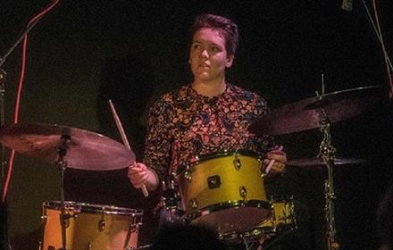 Woman playing the drums