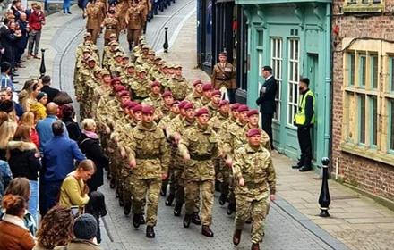 The Remembrance Day parade in Durham City, marching down Saddler Street