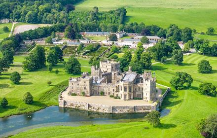 An overhead drone shot of the castle and grounds