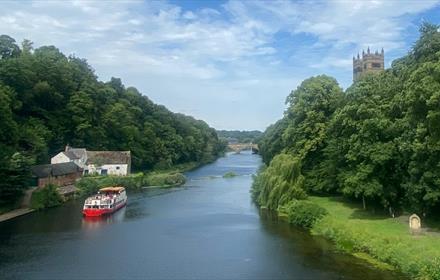 River Wear in Durham City. Riverbanks, Durham Cathedral on the right.