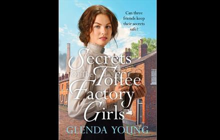 Front cover of the Glenda Young book Secrets of the Toffee Factory Girls.  A young woman in period dress