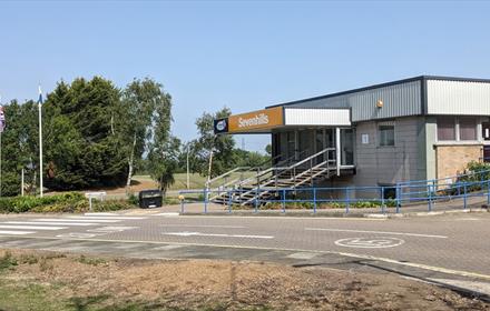View of the entrance to Sevenhills on a sunny day.